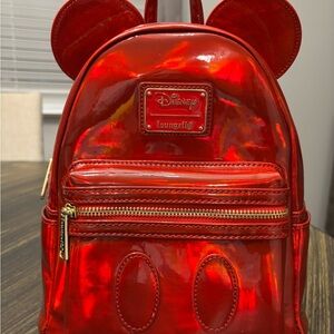 Loungefly Exclusive Mickey Mouse Holographic Series Mini Backpack in Ruby Red.